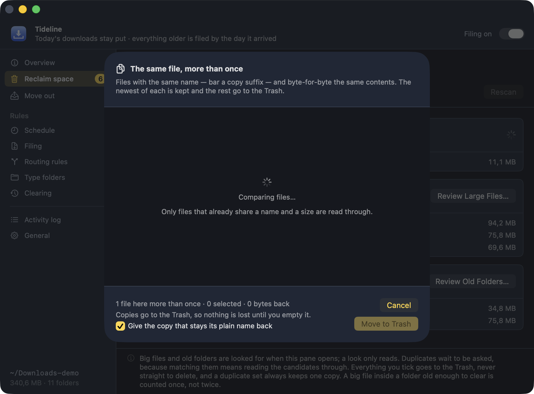 The duplicate review: files grouped by what they really are, the newest of each kept and the rest ticked for the Trash, each row with a magnifier that opens it in Finder